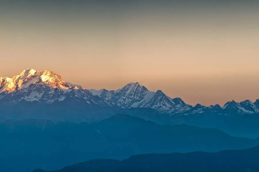 Snow peaks above the ridges near Pokhara at dawn