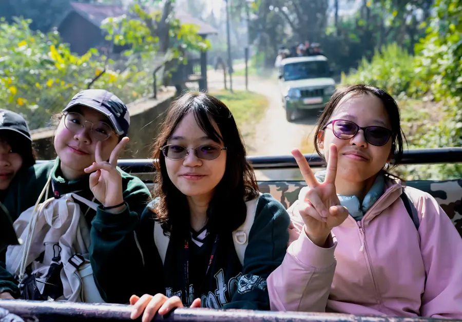 Students in an open jeep on the forest track at Bardiya